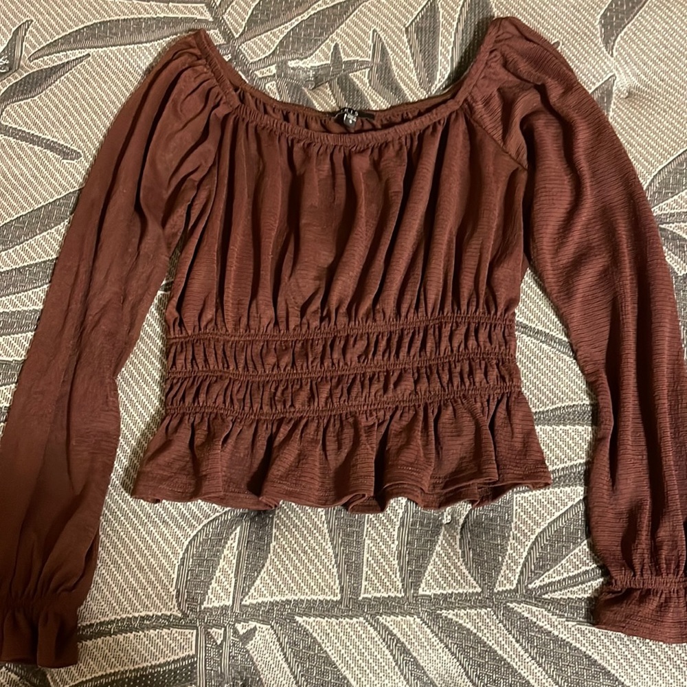 long sleeve shirt can be worn off the shoulder